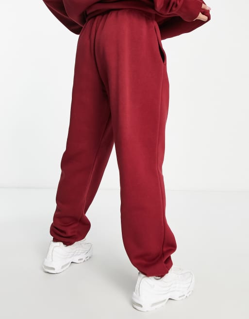 Nike Mini Swoosh oversized joggers in red, ASOS