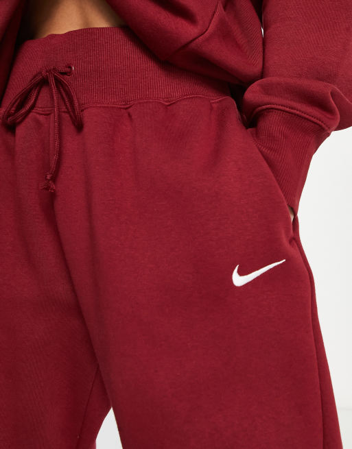 Nike Mini Swoosh oversized joggers in red, ASOS