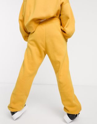 nike mini swoosh oversized yellow joggers