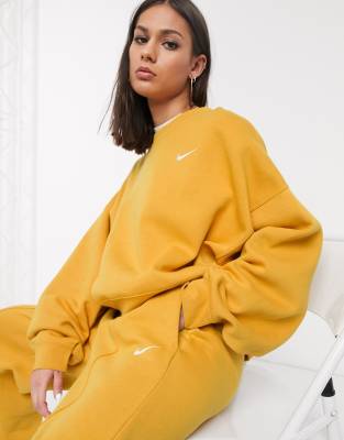 nike mini swoosh oversized yellow joggers