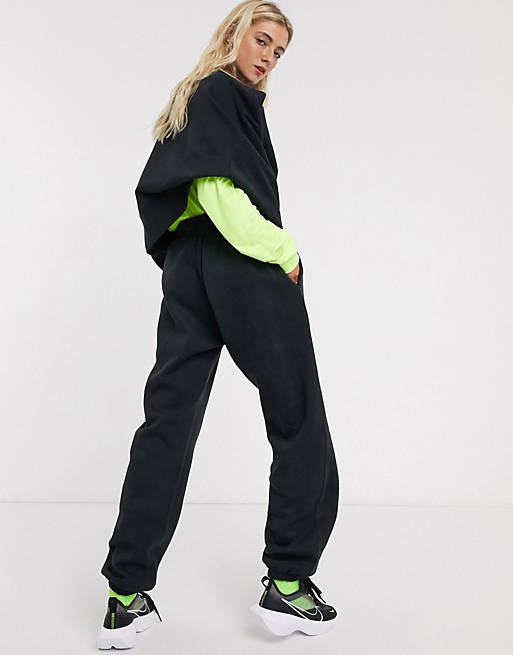 Nike mini swoosh oversized sweatpants in black