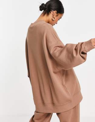 nike mini swoosh oversized tracksuit in earth brown