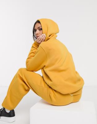 nike mini swoosh oversized boxy sweatshirt in yellow