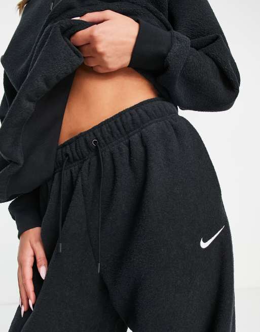 Nike mini Swoosh oversized joggers in black, £25.00