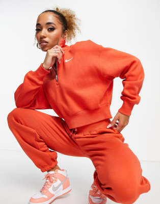 Nike - Rally Burnt - Pantalon de jogging à logo - Orange, ASOS