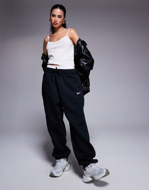 Nike Mini Swoosh sweatpants in black - view 1