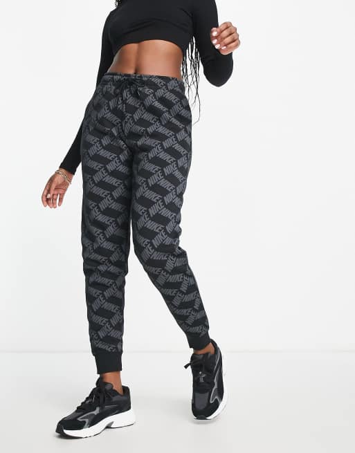 Nike Monogram all over logo print fleece cuffed sweatpants in