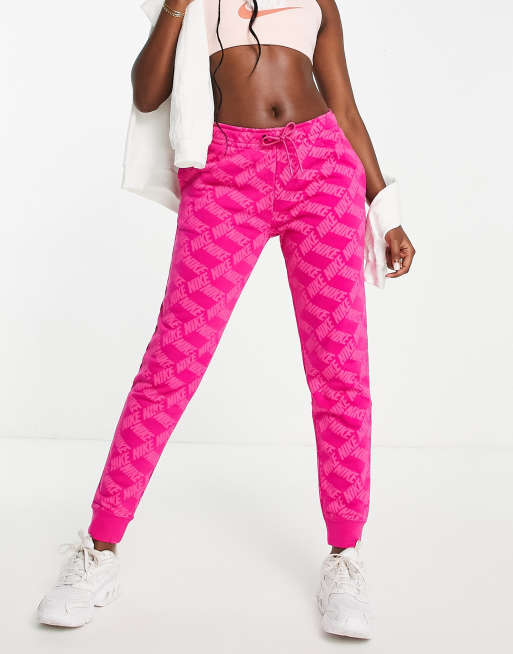 Nike monogram all over logo print fleece cuffed sweatpants in pink PINK ASOS