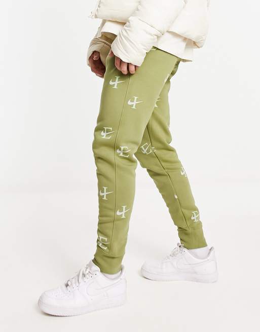  Nike Monogram All Over Logo Print Fleece Cuffed Sweatpants in  Pink : Clothing, Shoes & Jewelry