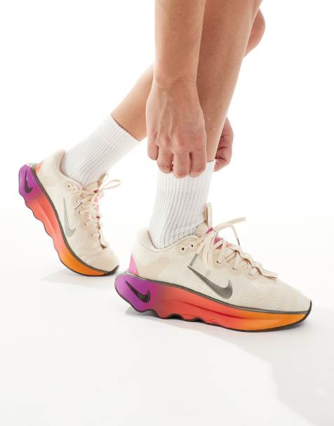Nike Motiva sneakers in white & gold - view 1