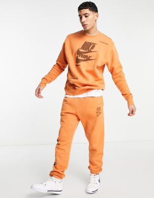 Nike Multi-Futura cuffed fleece sweatpants in dusty orange