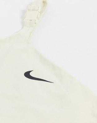 nike one shoulder buckle crop top in off white