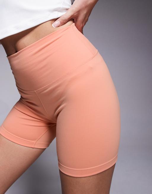 Nike One Training Dri-FIT high waist 5-inch shorts in orange