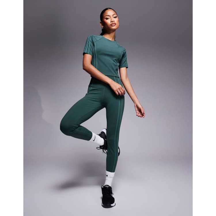 Nike One Training Dri FIT reflective piping high waisted 7 8 leggings in green ASOS