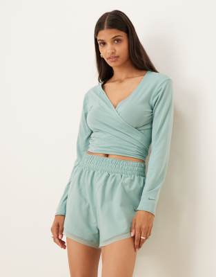 Nike One Training Dri-FIT relaxed wrap longsleeve top in light blue