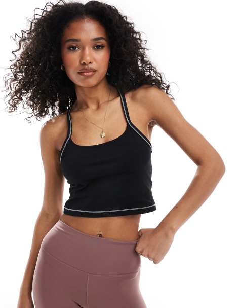 Nike One Training Dri-FIT stitch detail cropped ribbed tank top in black - view 1