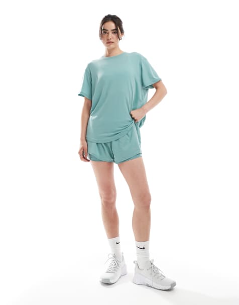 Nike One Training highwaisted 3 inch 2 in 1 shorts and relaxed t-shirt in light blue - view 1