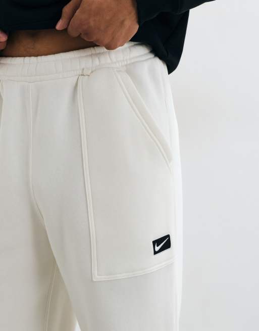 Nike open hem joggers with logo graphic in cream, 5 of 5