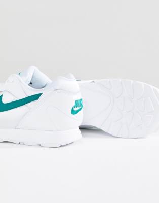 nike outburst trainers in white and green