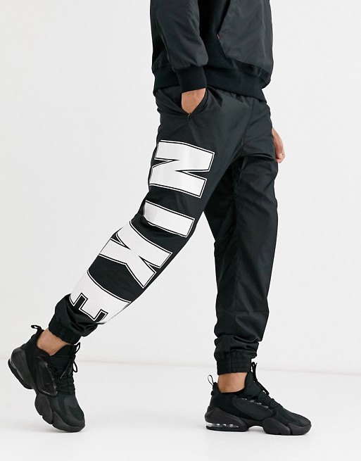 Nike overbranded cuffed joggers in black