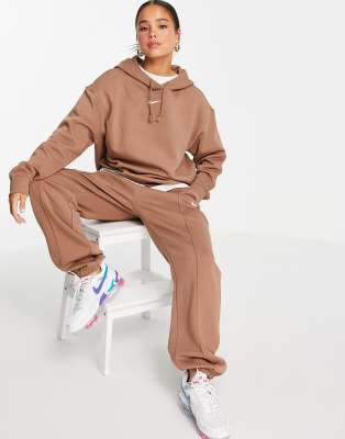 nike mini swoosh oversized tracksuit in earth brown