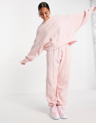 Nike mini swoosh oversized fleece joggers in fierce pink