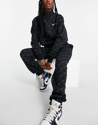Nike oversized joggers in black with all over swoosh print - ASOS Price Checker