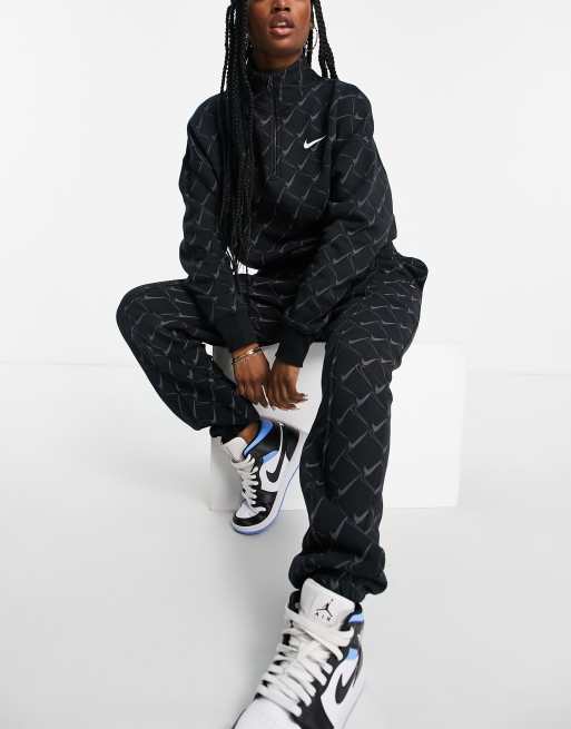 Nike tick discount all over tracksuit