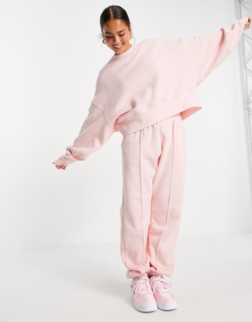 Nike - Oversized joggingbroek van fleece in lichte koraalkleur