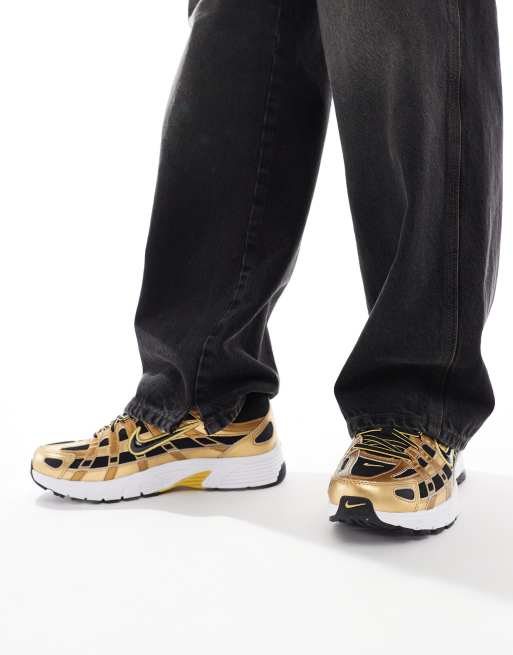 Nike P-6000 sneakers in black and gold