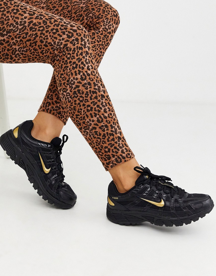 Nike – P-6000 – Svarta och guldfärgade sneakers