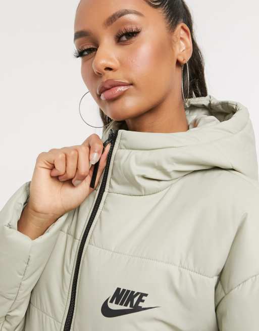 Nike padded jacket with back swoosh in beige ASOS