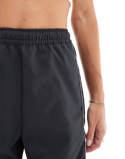 Nike paneled woven pants in black