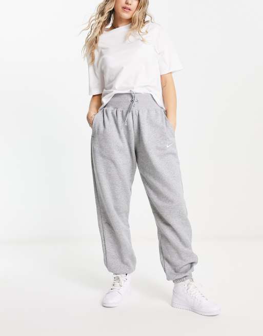 Nike Pantalon de jogging en polaire pour femme (gris foncé/blanc, taille  M), BLANC : : Mode