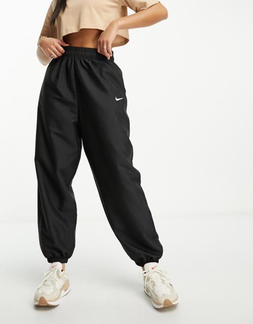 Nike Pantalon de jogging tendance tisse Noir ASOS