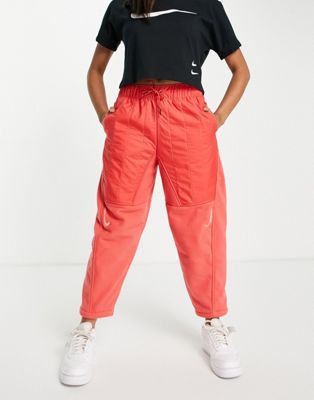 Femme Nike - Pantalon tissé taille haute à logo virgule - Rose homard