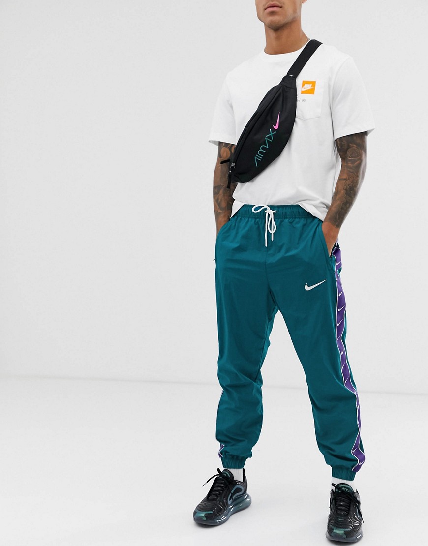 Nike - Pantaloni felpati verdi con fettuccia e logo-Verde
