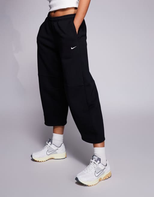Nike Phoenix barrel leg pants in black | ASOS