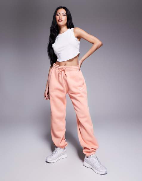 Nike Phoenix Fleece high waisted oversized cuffed joggers in pink - view 1
