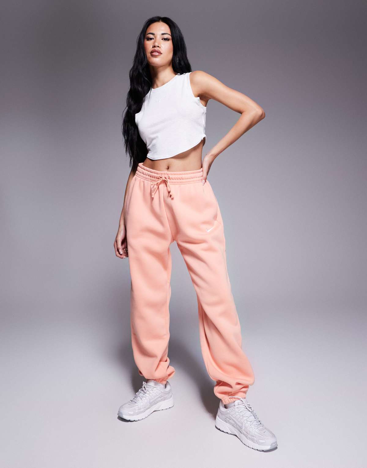 Nike Phoenix Fleece high waisted oversized joggers in pink
