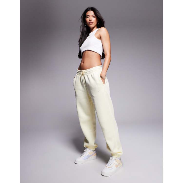 Nike Phoenix Fleece high waisted oversized joggers in yellow | ASOS