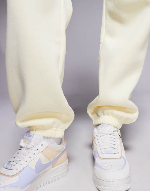 Nike Phoenix Fleece high waisted oversized joggers in yellow ASOS
