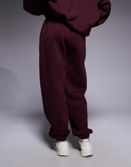 Nike - Phoenix Fleece- Højtaljede og oversized bordeauxrøde joggingbukser med tætsiddende buksekanter, 4 af 5