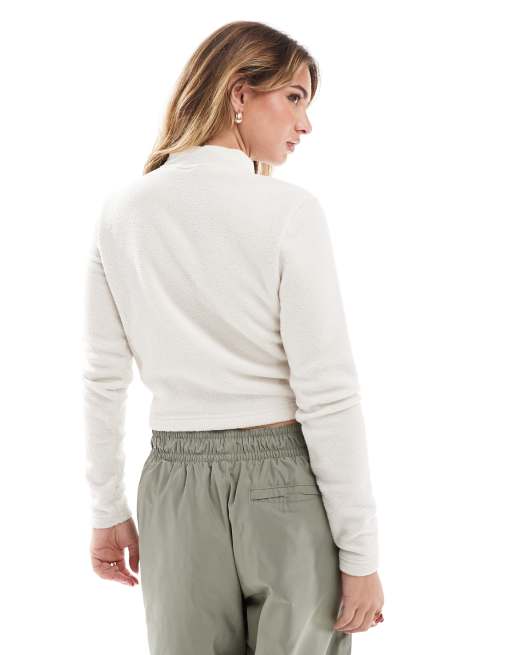 Nike Phoenix plush half zip long sleeve top in beige | ASOS