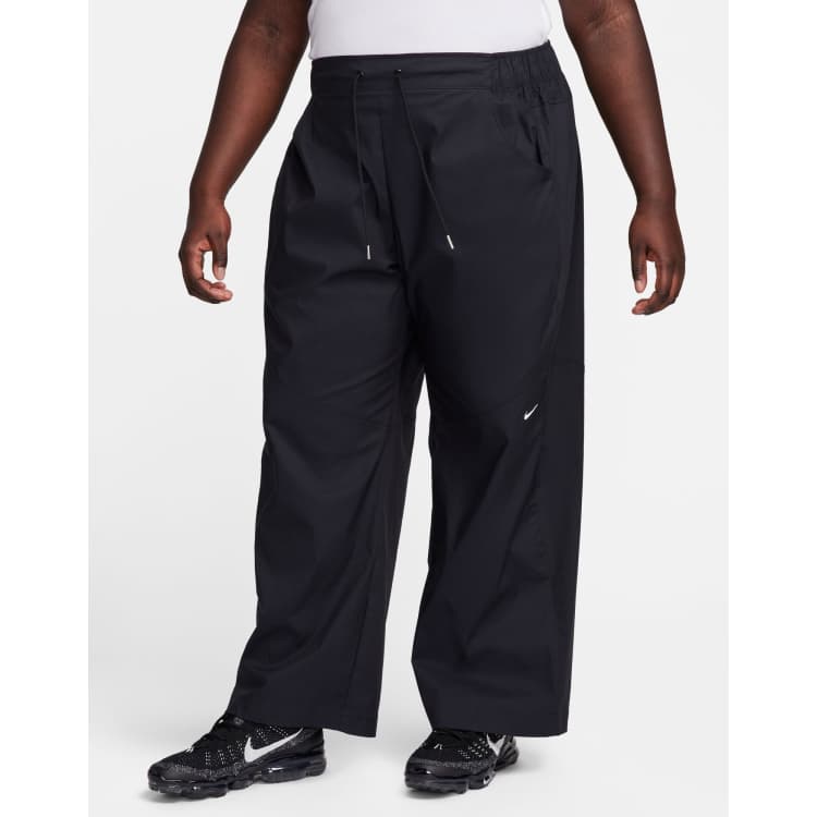 Nike Plus essential woven high rise trouser in black ASOS