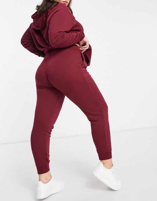 Nike Yoga jumpsuit in burgundy, ASOS