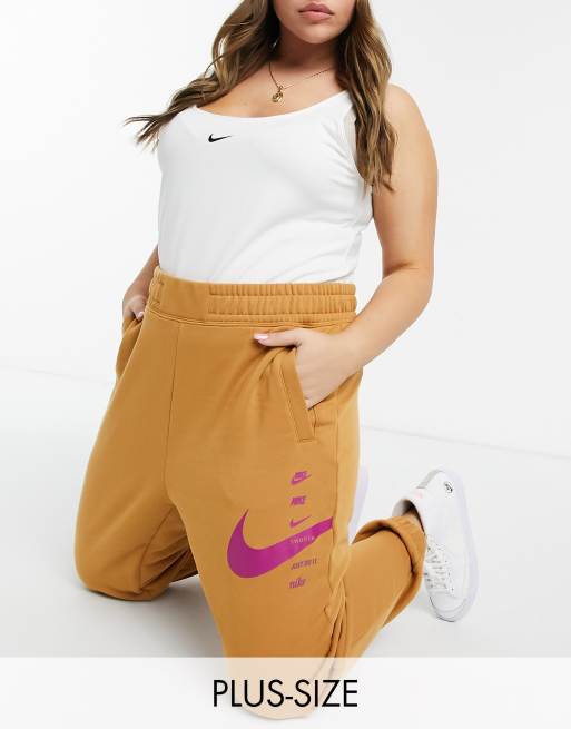 Nike Plus high waisted swoosh joggers in beige