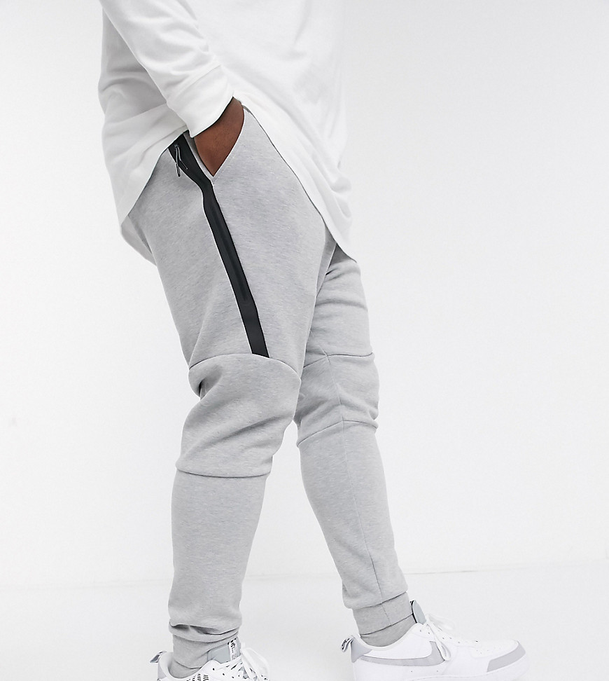 Nike Plus - Joggers in pile tecnico con fondo elasticizzato grigi-Grigio