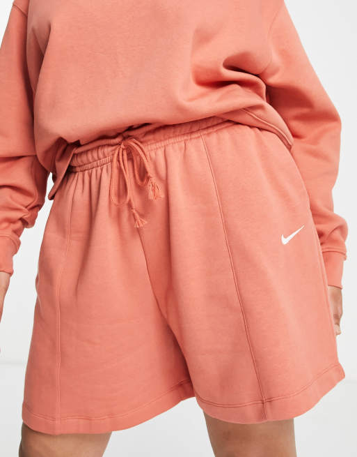 Nike Plus mini swoosh fleece shorts in madder root