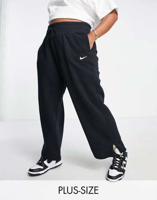 Nike Plus mini swoosh high rise wide leg joggers in black and sail